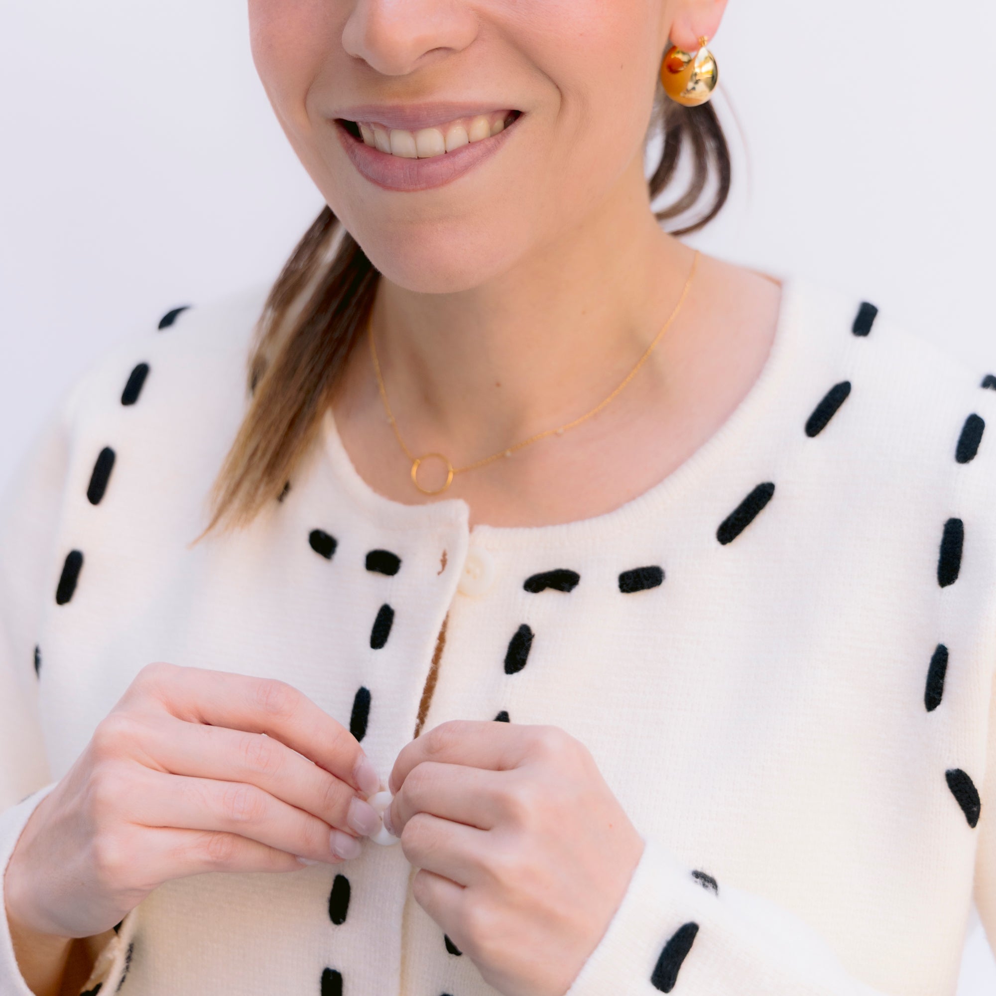 Sueter marfil con toques negros