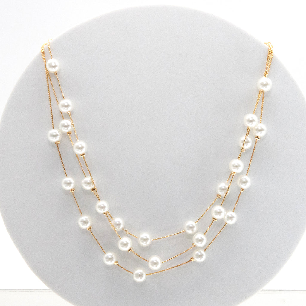 Set collar, aretes y pulsera de perlas chicas