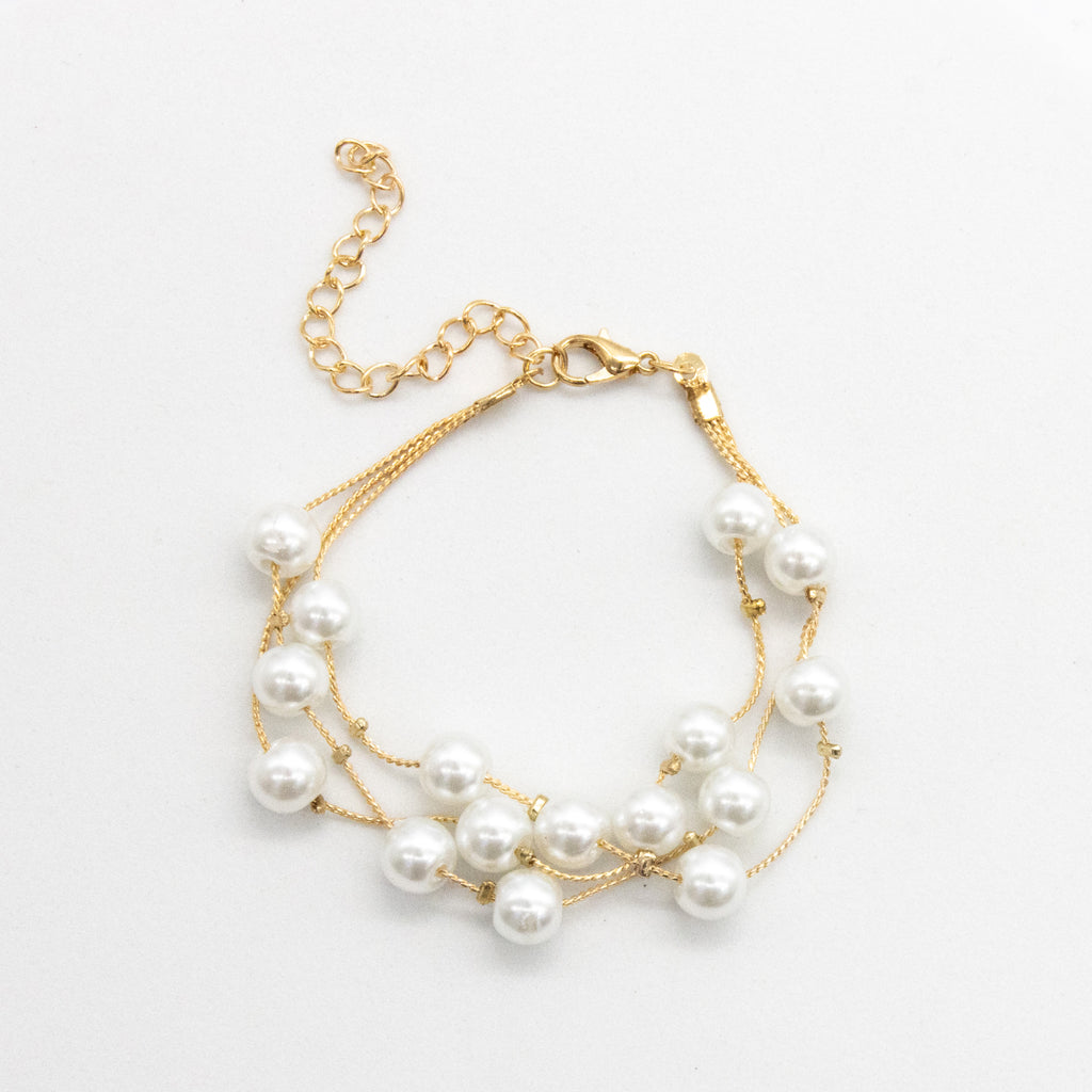 Set collar, aretes y pulsera de perlas chicas