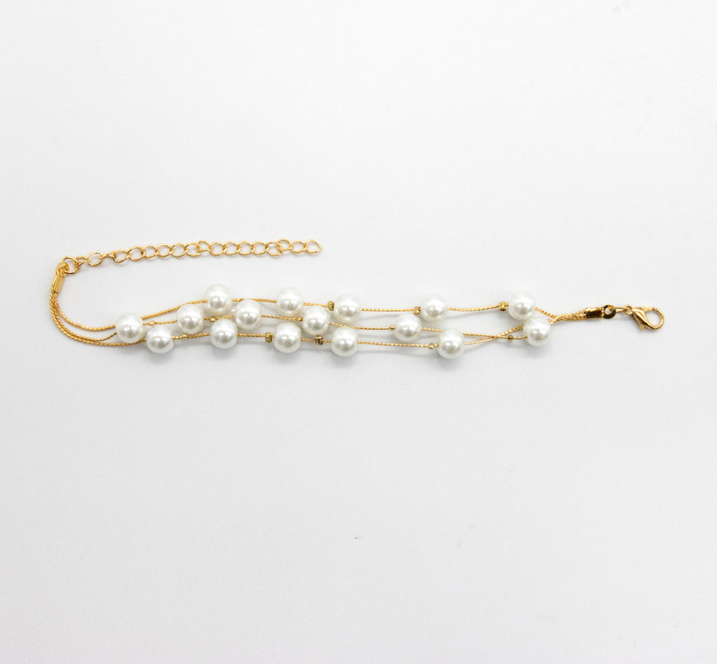 Set collar, aretes y pulsera de perlas chicas