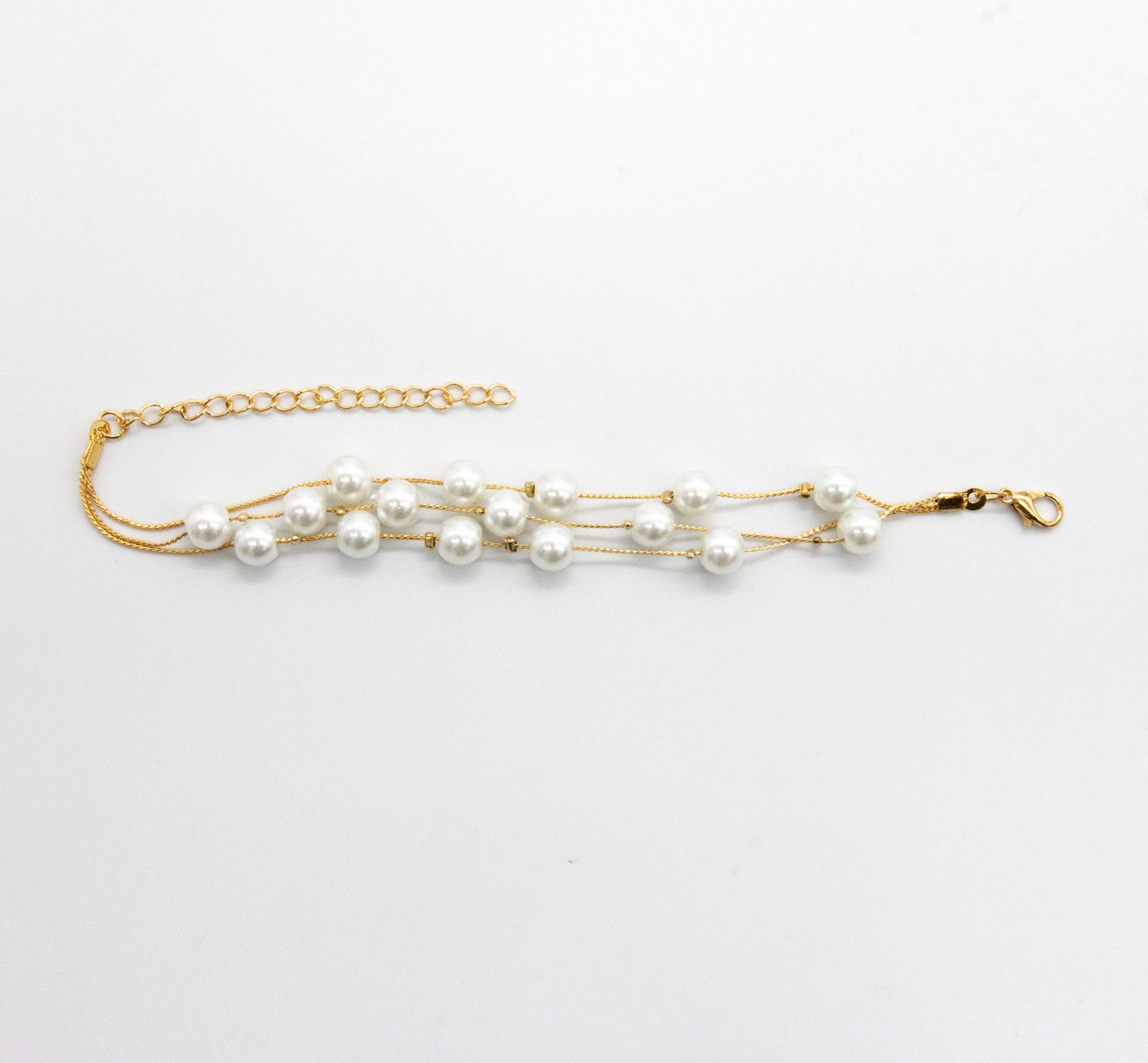 Set collar, aretes y pulsera de perlas chicas